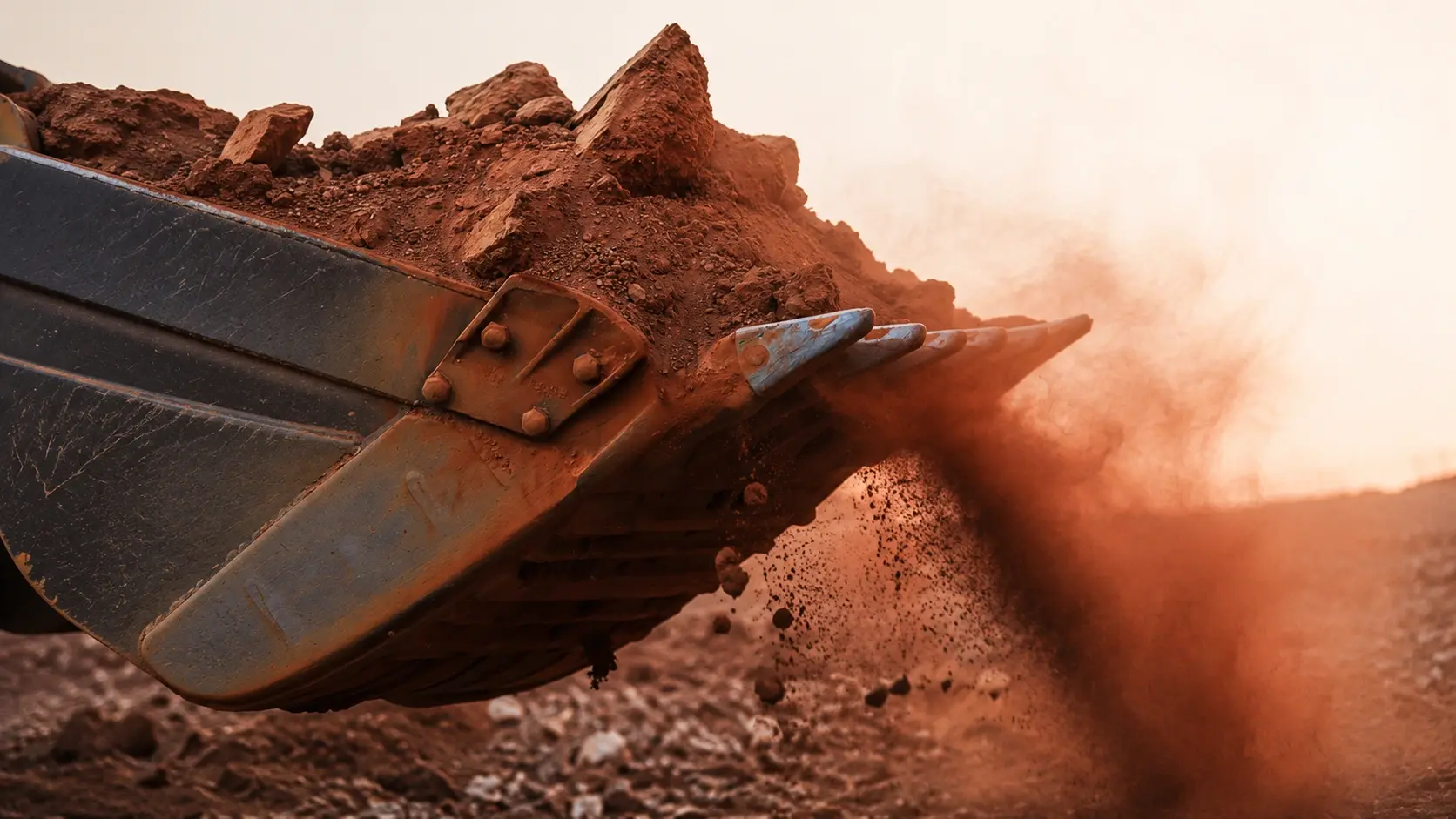 precon-excavator-bucket-breaking-ground